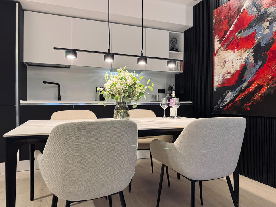 Luxury custom-made CREO kitchen with dining table.