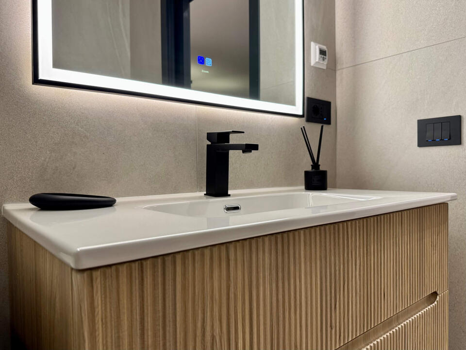High-end fixtures and appliances in this spacious designer bathroom.